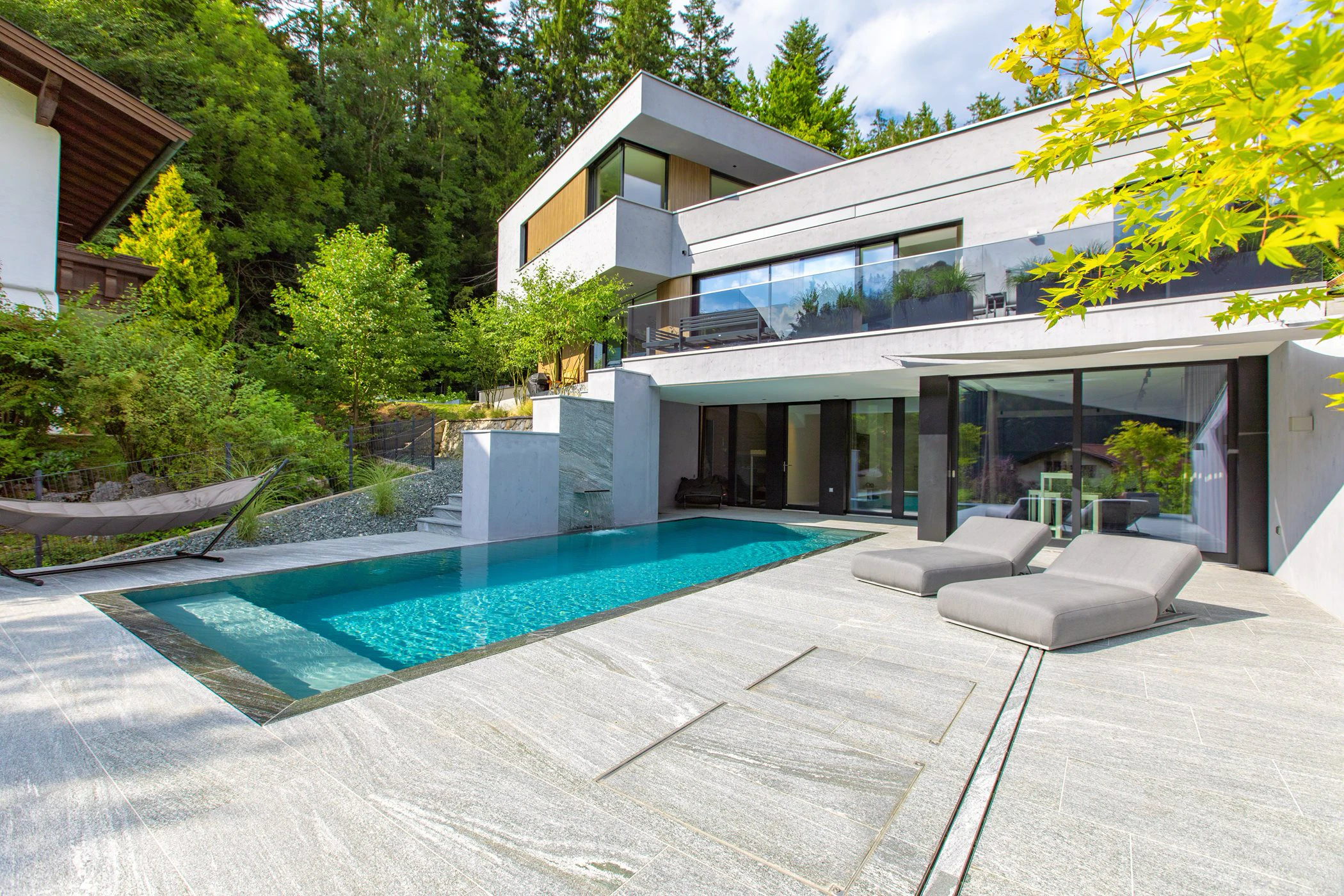 a house with a pool and a deck