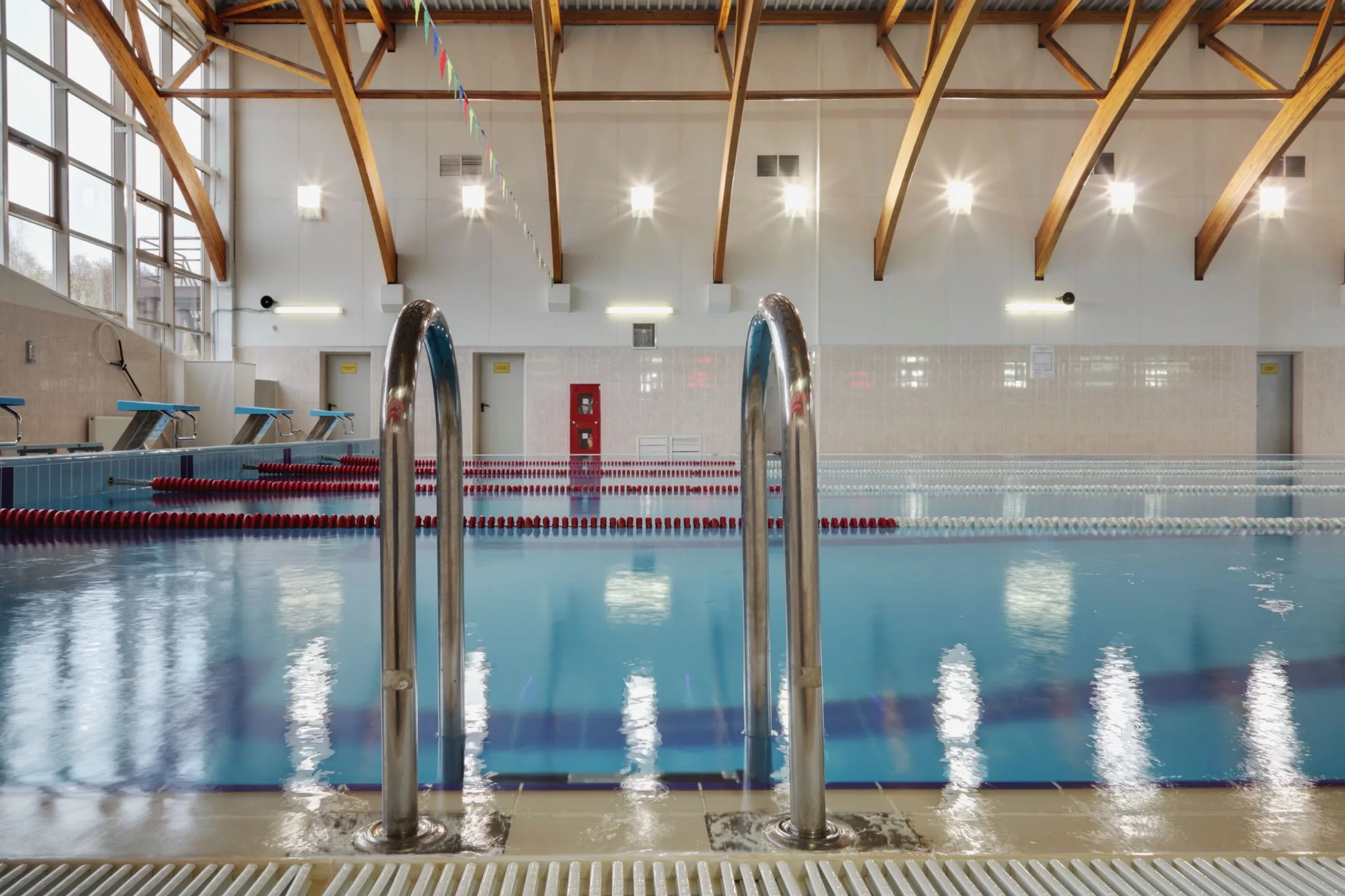 Commercial swimming pool with metal ladders